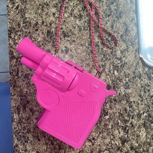 Gun shaped plastic clutch purse